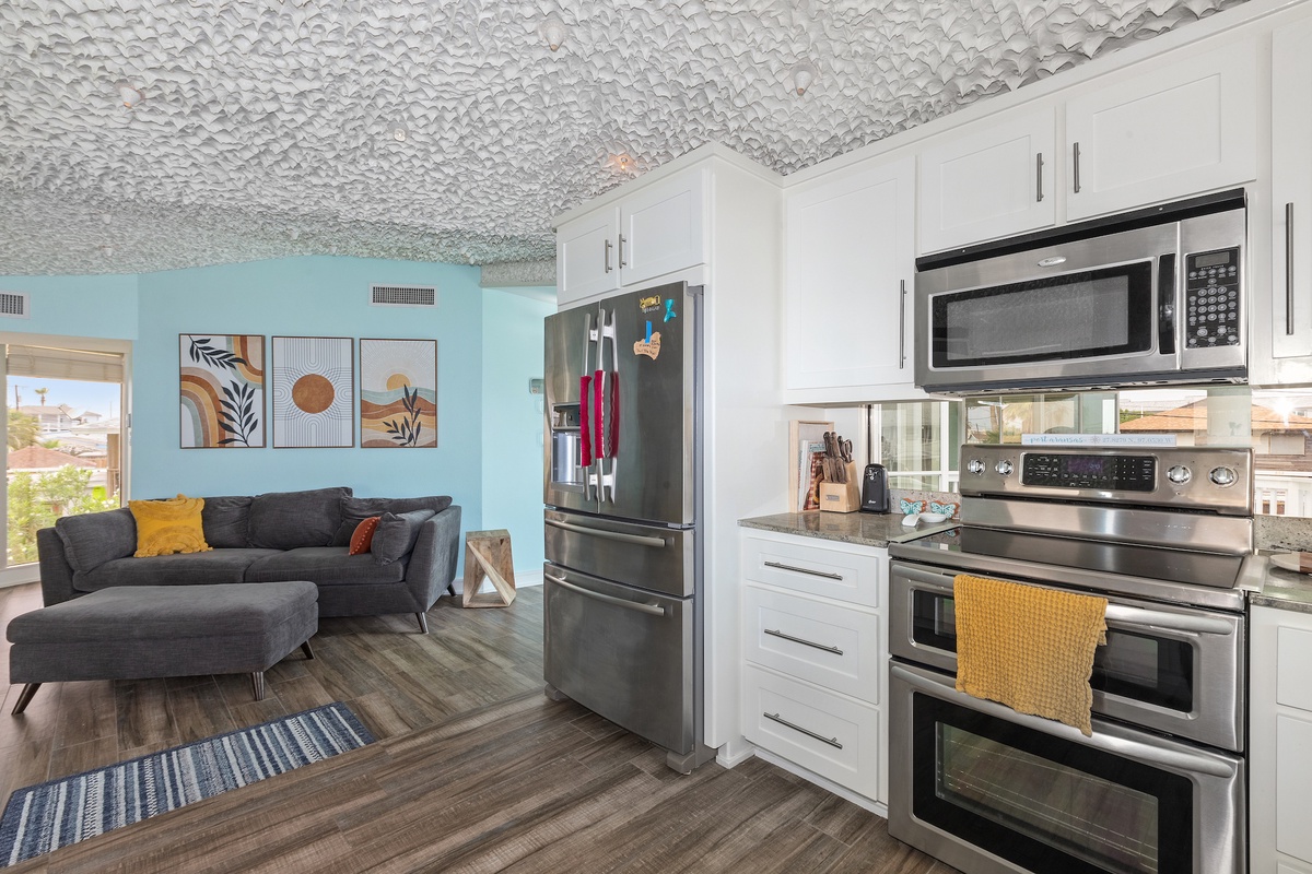 Cook your favorite meals in your fully equipped kitchen with stainless appliances, then relax on the plush sectional sofa.