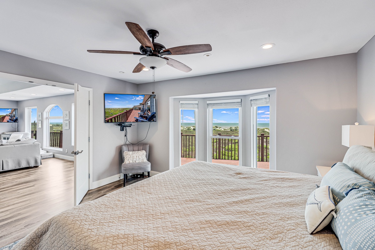 Wake up to breathtaking ocean views from your spacious master bedroom, where morning light streams through expansive windows.