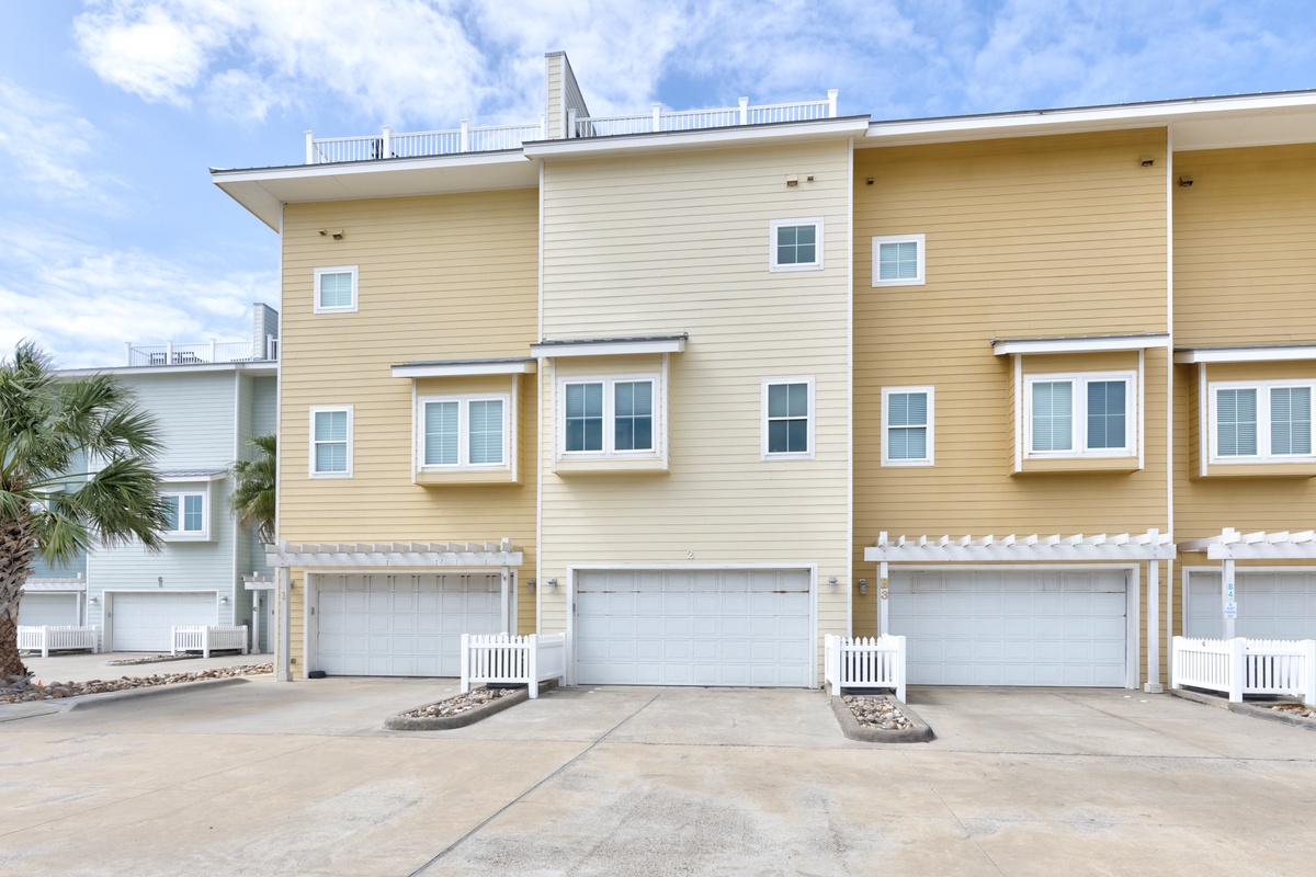 Modern townhomes with convenient parking and coastal charm, featuring multiple levels and private garage access in a well-maintained community setting.