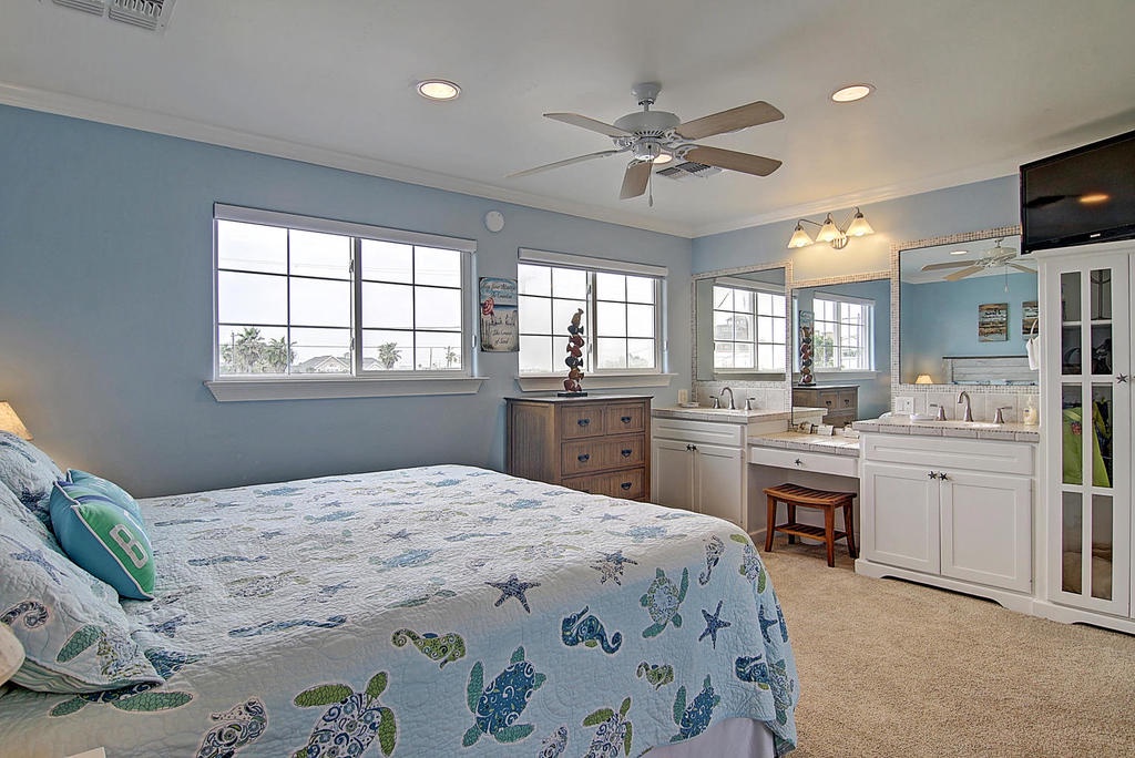Your master suite combines comfort and convenience with a stunning ensuite kitchenette, perfect for morning coffee or late-night snacks in relaxed coastal style.