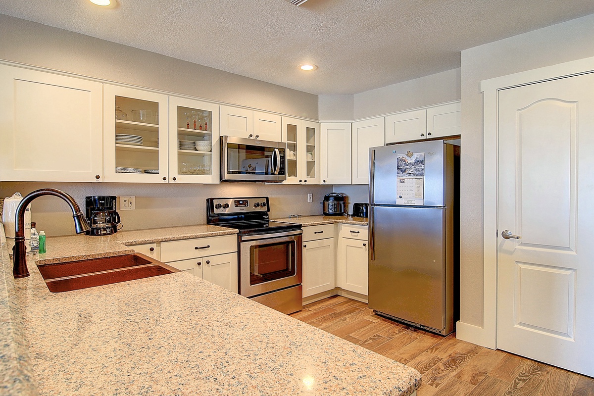 Your fully equipped kitchen features granite counters, stainless appliances, and everything you need to prepare memorable meals during your stay.