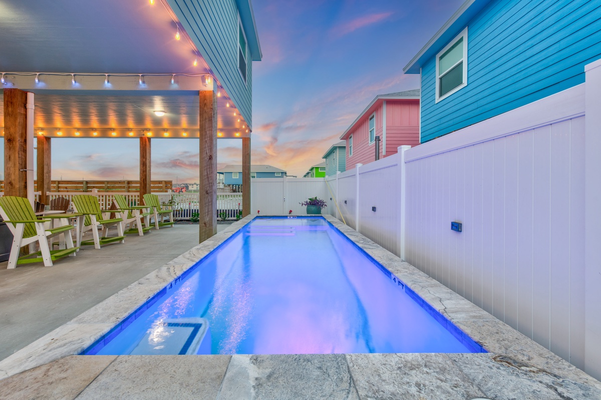 Your private pool glows under string lights as sunset paints the sky, creating the perfect evening retreat.