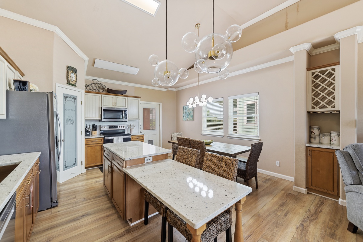 The spacious kitchen overlooks the dining and living areas, making it easy to cook, dine, and spend time together.
