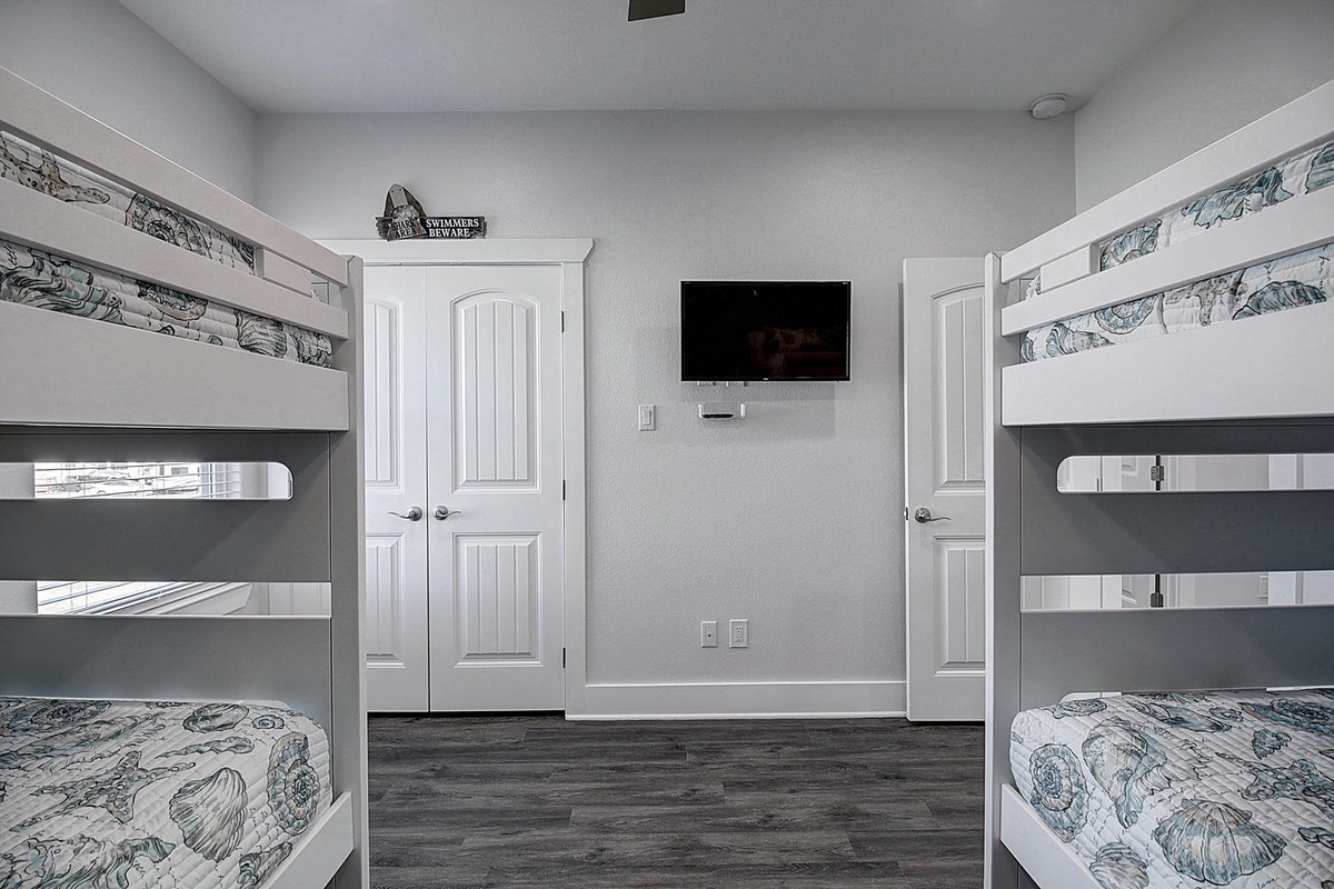 Your kids will love their own adventure-themed bunk room with built-in entertainment and private wardrobe storage.