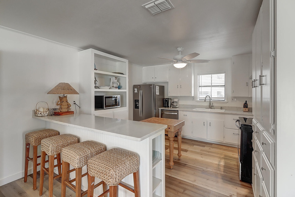 Your spacious kitchen features modern stainless appliances and a breakfast bar where you'll enjoy morning coffee together.