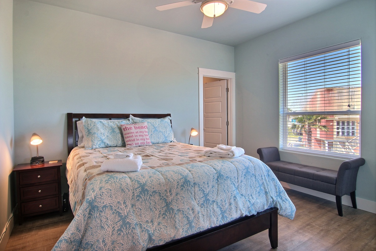 Rest peacefully in your serene bedroom with coastal-inspired decor, plush linens, and gentle natural light streaming through.
