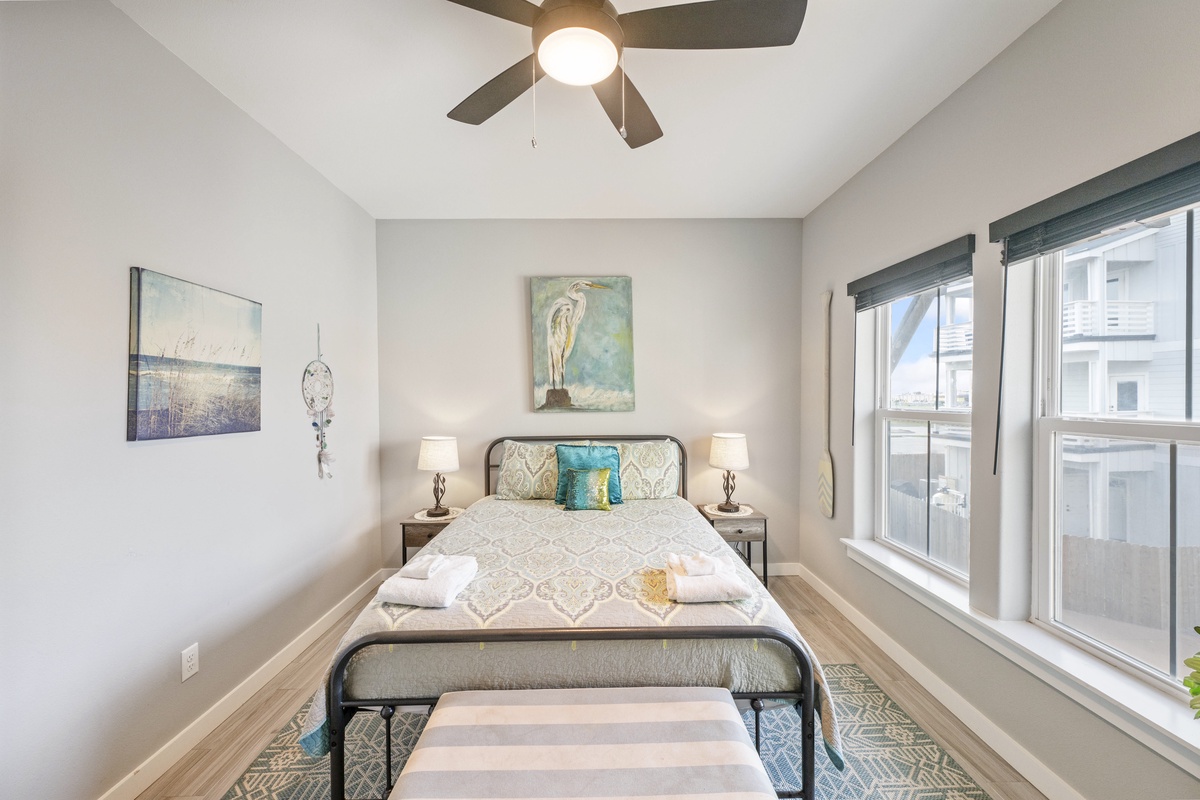 Drift off to peaceful sleep in your cozy bedroom with soft linens, warm lighting, and gentle ceiling fan breeze.