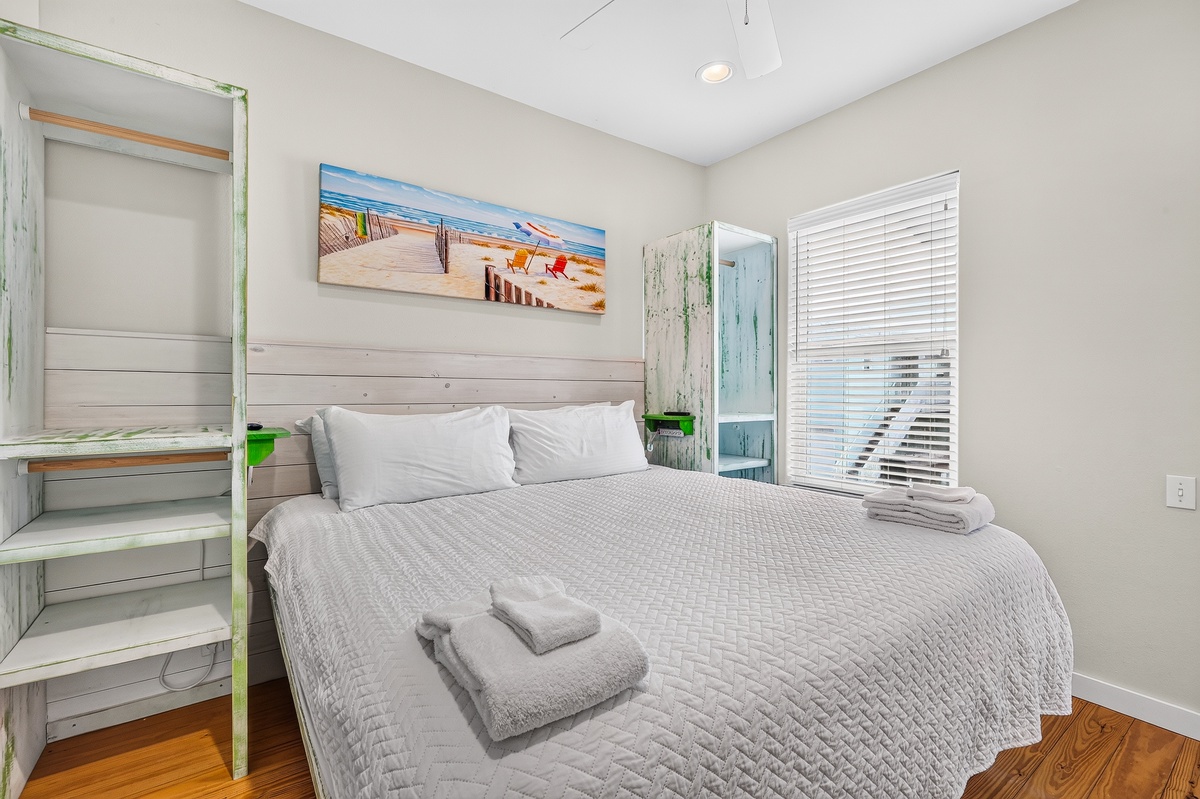 Unwind in this coastal-inspired bedroom where the beach is never far from your mind. Soft linens invite restful sleep, while warm wood floors and thoughtful touches create your personal retreat after sunny days exploring.