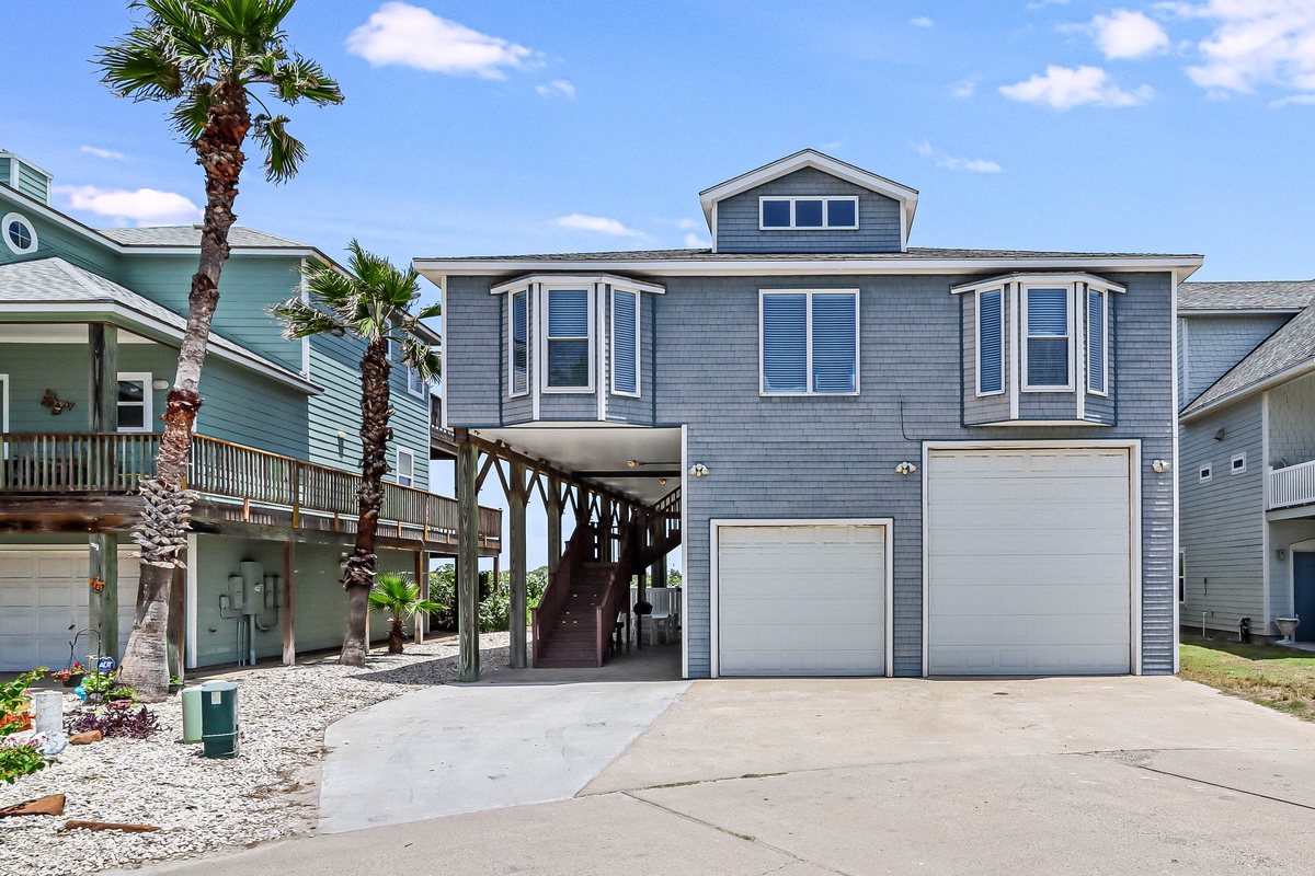 Coastal vacation home with elevated design and convenient parking in a charming beach community setting.
