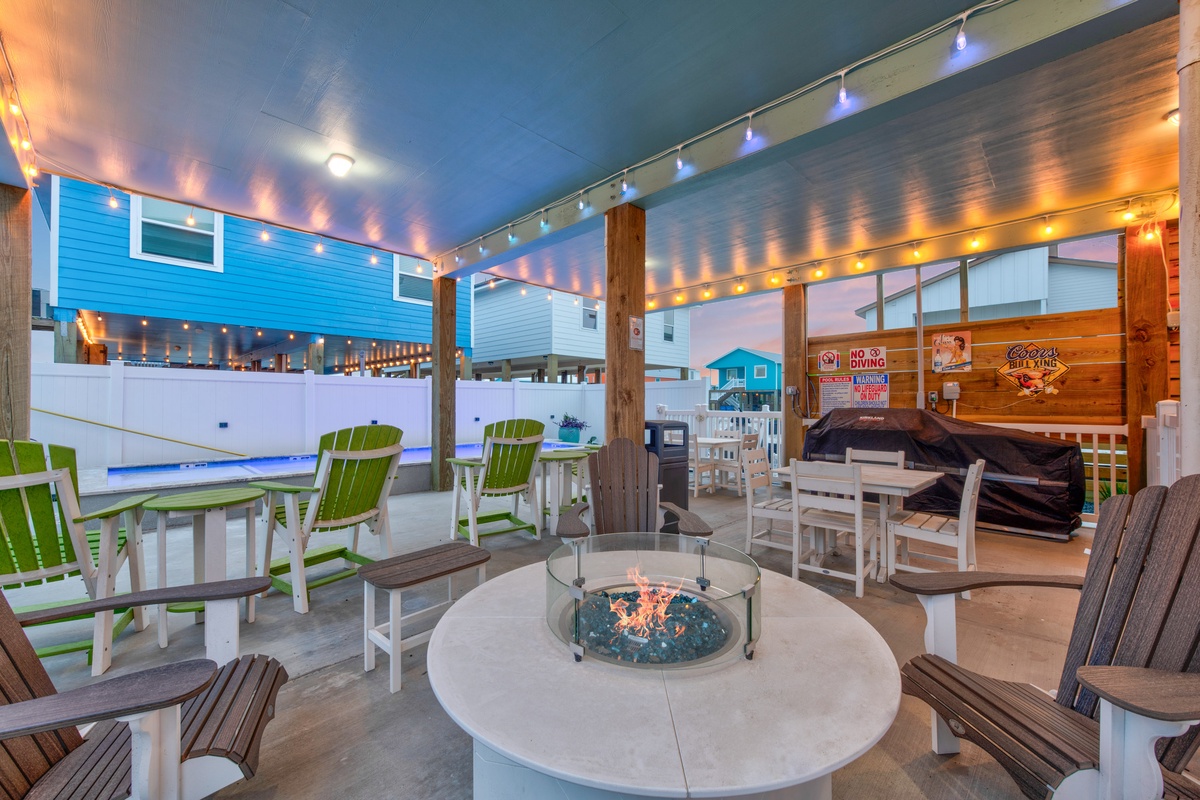 Gather around your private fire pit under twinkling lights, where cozy conversations and s'mores await on this magical covered terrace.