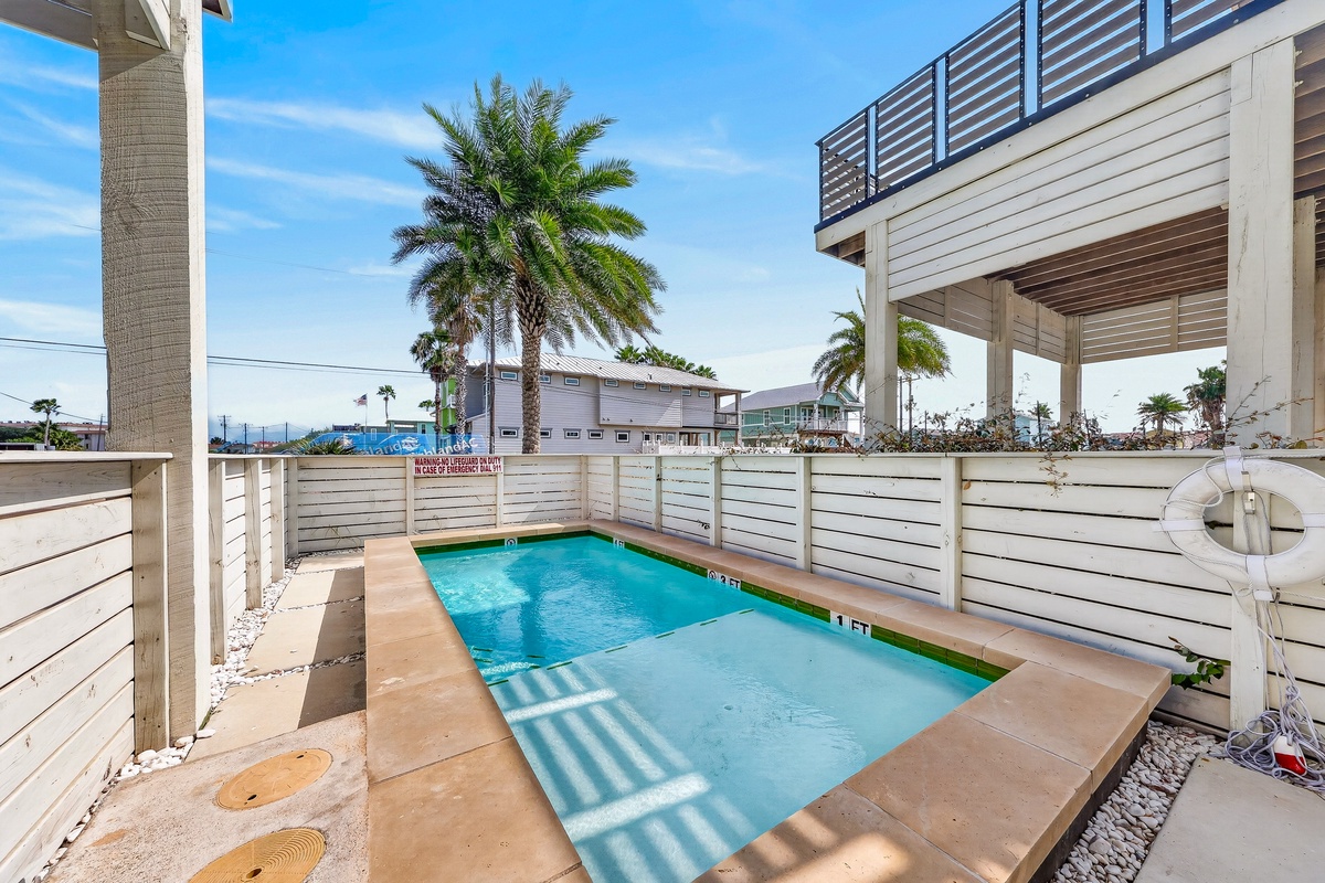 Your own private pool awaits, framed by swaying palms and coastal sunshine, perfect for lazy afternoons under clear blue skies.