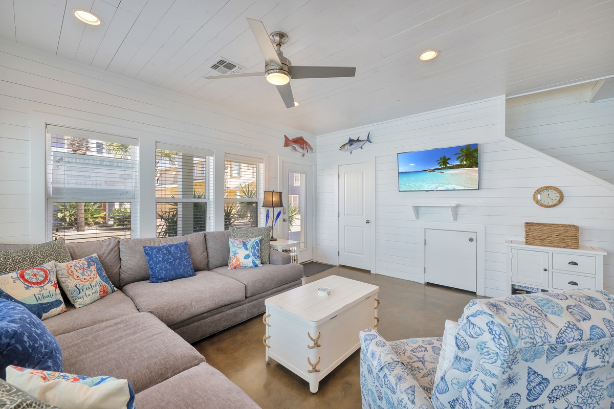 Relax in this coastal-inspired living room where nautical touches and ocean blues create your perfect beach getaway atmosphere.