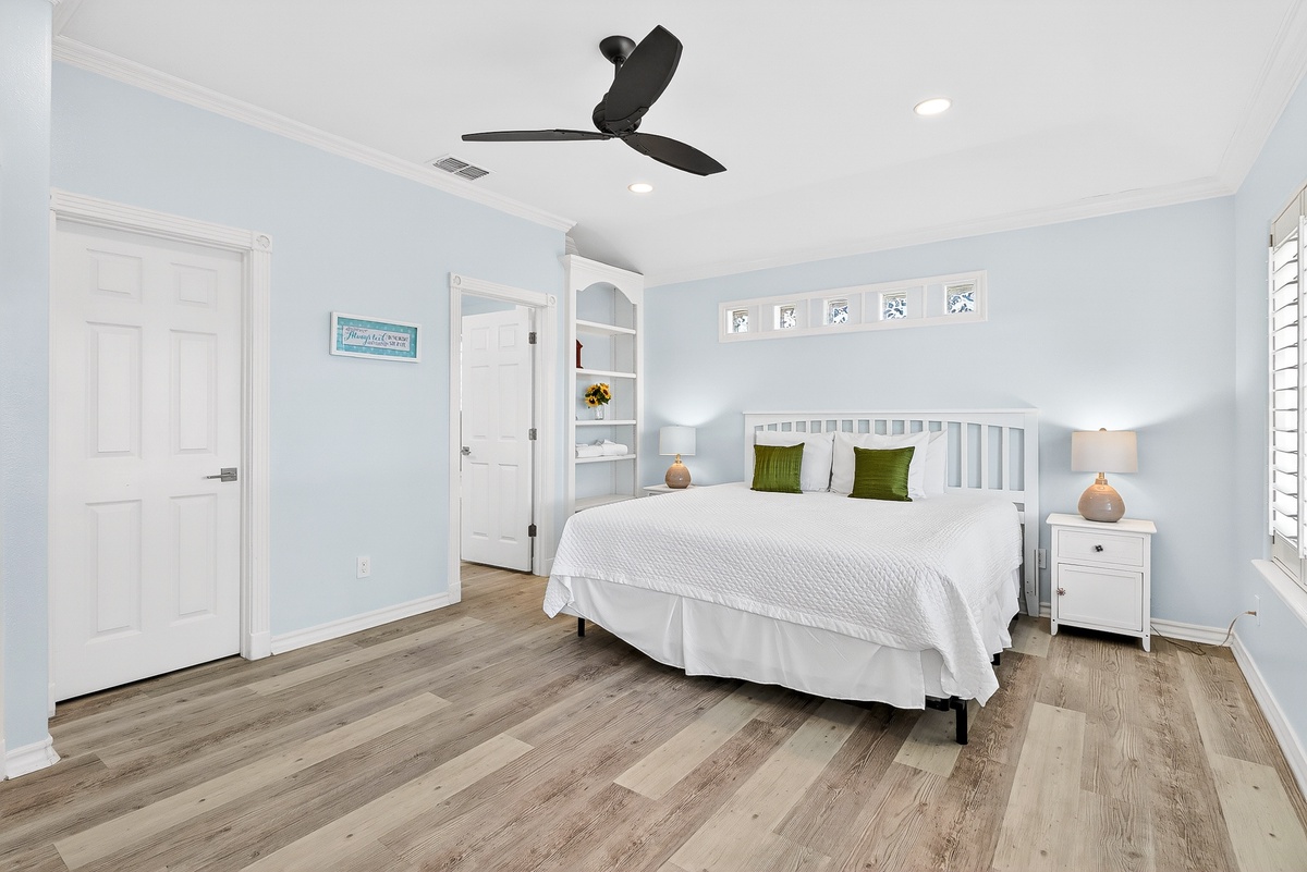 Drift off in your peaceful sanctuary with soft blue walls, crisp white linens, and calming coastal touches.