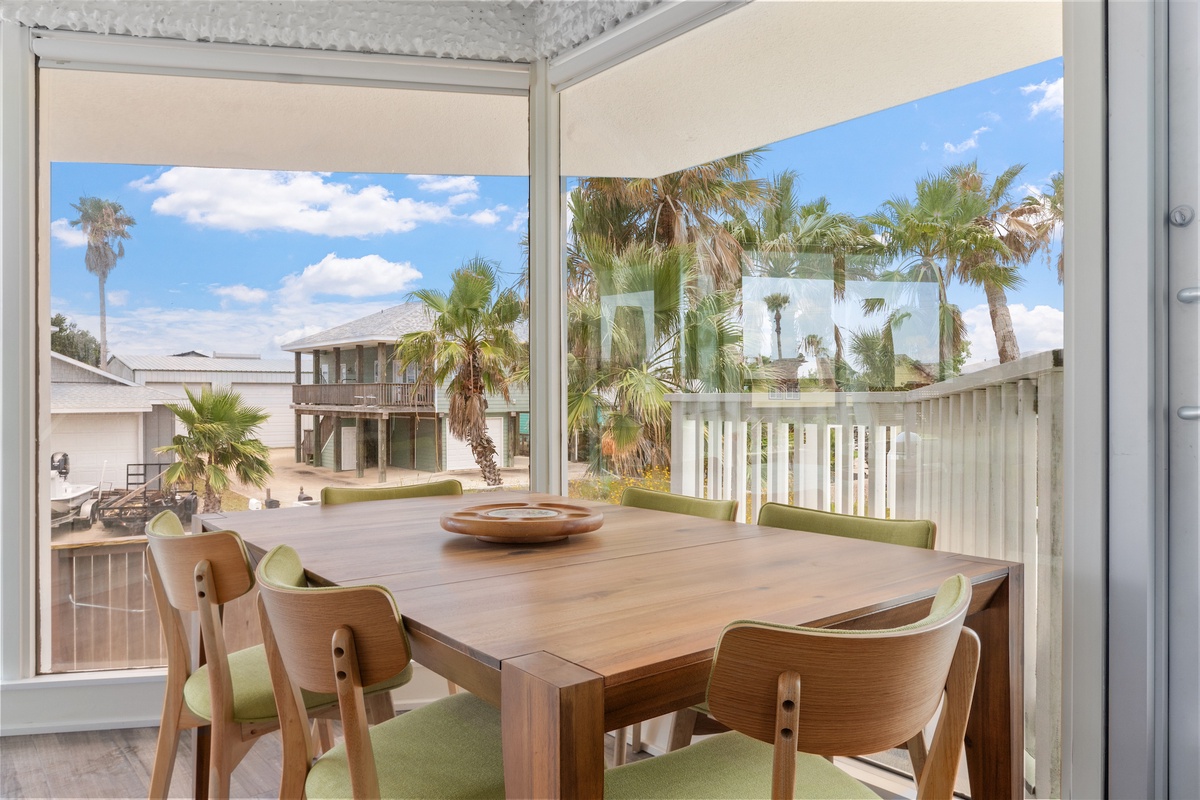 Gather around your private dining table where tropical views create the perfect backdrop for memorable meals together.
