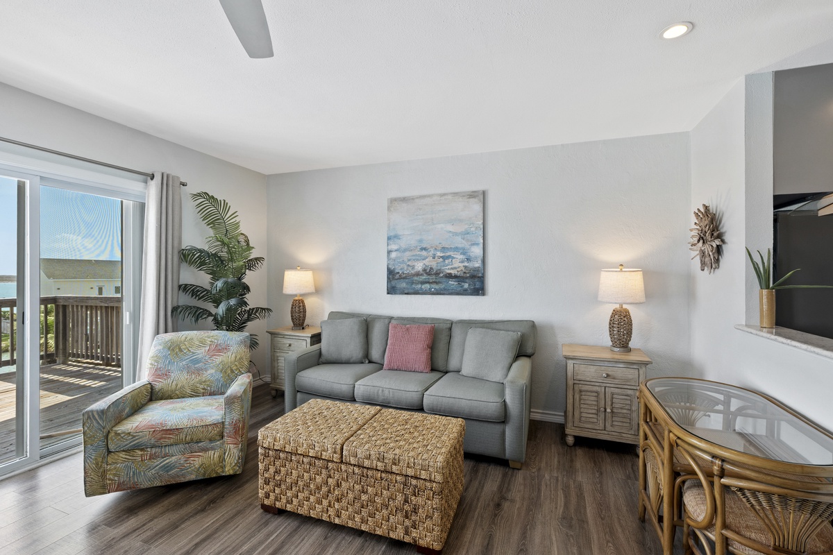 Your bright living space features coastal décor and sliding doors to your private balcony, perfect for relaxing after beach days.