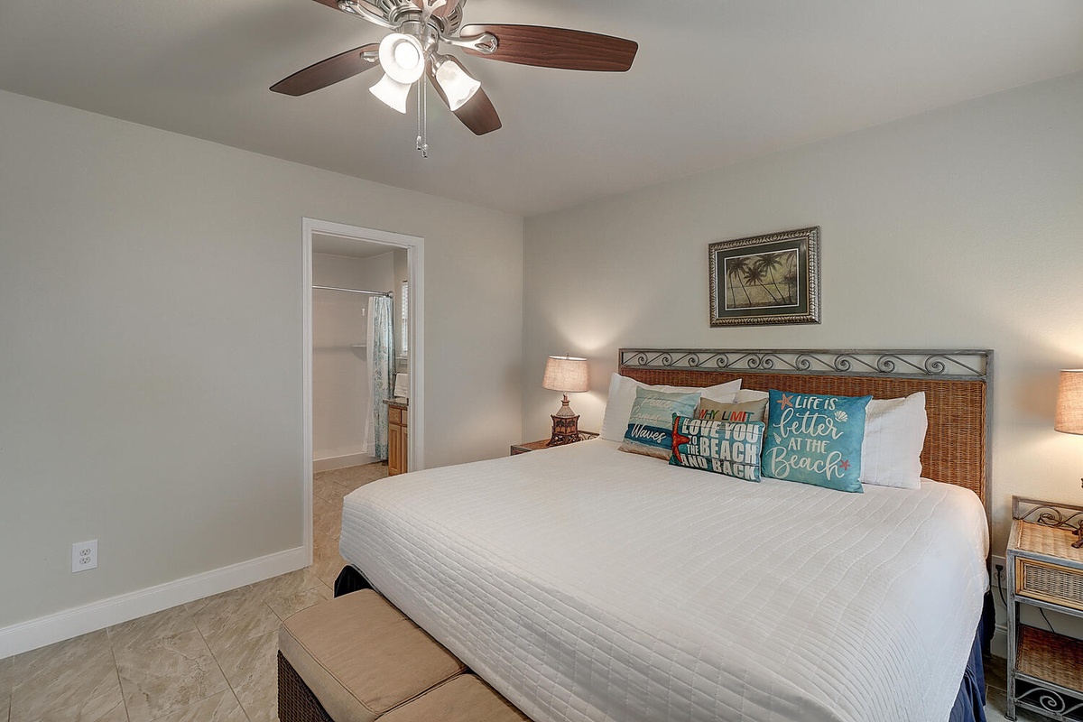 Rest peacefully in your coastal-themed bedroom with beach-inspired pillows and soft lighting for ultimate relaxation.