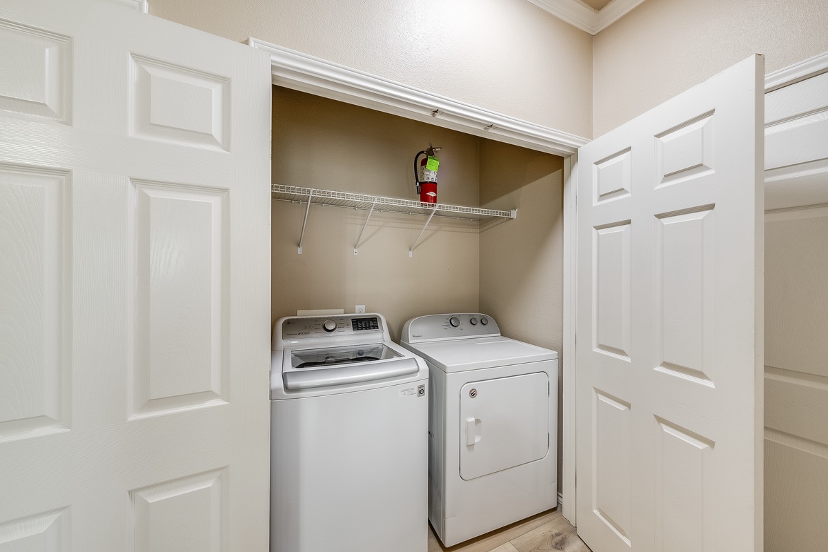 Your private laundry closet features full-size washer and dryer, keeping your clothes fresh throughout your stay.