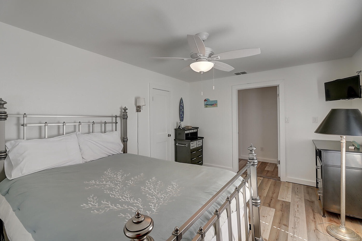 Drift into peaceful sleep in your serene bedroom, where soft linens and gentle ceiling fan breezes create the perfect retreat.