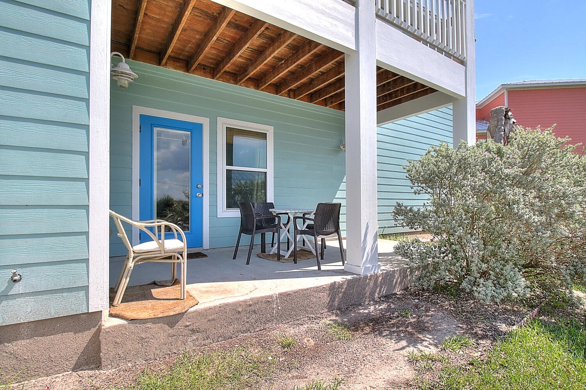 Charming coastal cottage with covered porch seating where you can sip your morning coffee and enjoy the peaceful neighborhood atmosphere.