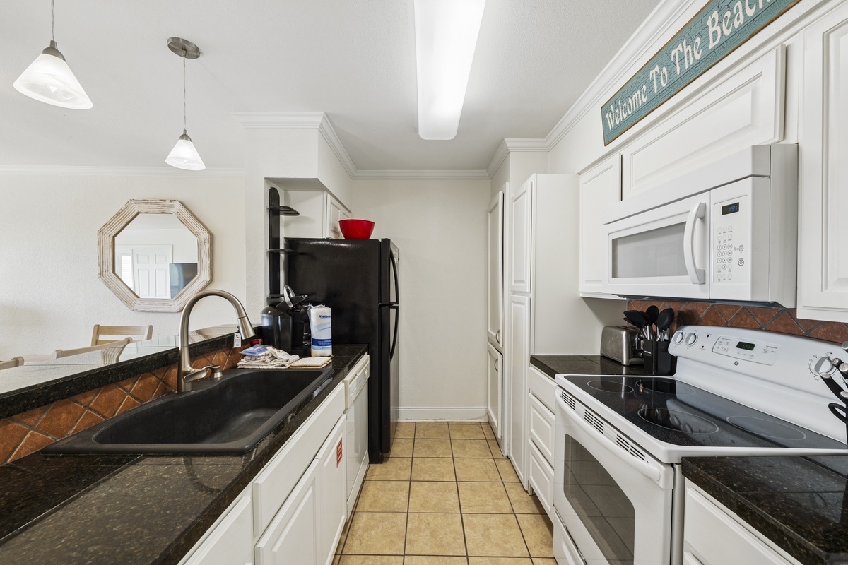 Your fully equipped kitchen features everything you need to cook up vacation favorites—sleek appliances, plenty of counter space, and charming coastal touches that make every meal feel special.