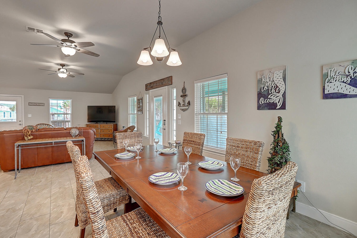 Gather around this beautiful dining table where memorable meals and laughter await. The open layout flows perfectly into your comfortable living space.