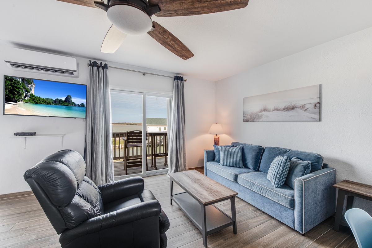 Relax in your stylish living room with comfy seating, tropical views on the big screen, and refreshing air conditioning.
