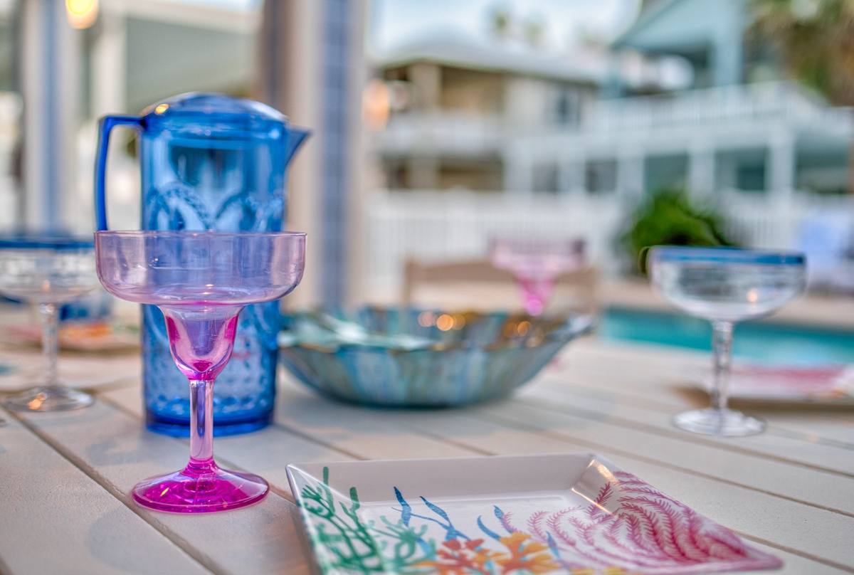 Sip your favorite drink from colorful glassware while enjoying the peaceful poolside atmosphere on your private terrace.