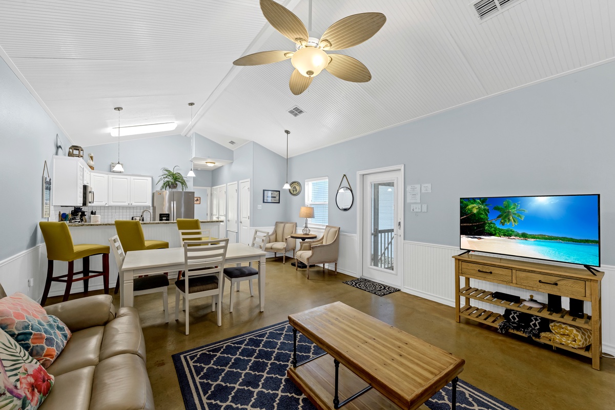 Your bright, open living space welcomes you with coastal charm and modern comfort, perfect for relaxing after beach adventures.