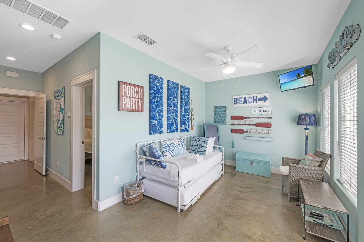 Relax in your coastal-themed retreat with beach vibes, comfortable daybed, and charming nautical decor that makes you feel right at home.