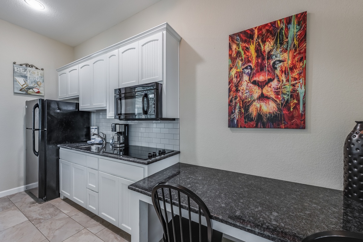 Your sleek kitchen features modern appliances and granite countertops, perfect for preparing meals during your stay.