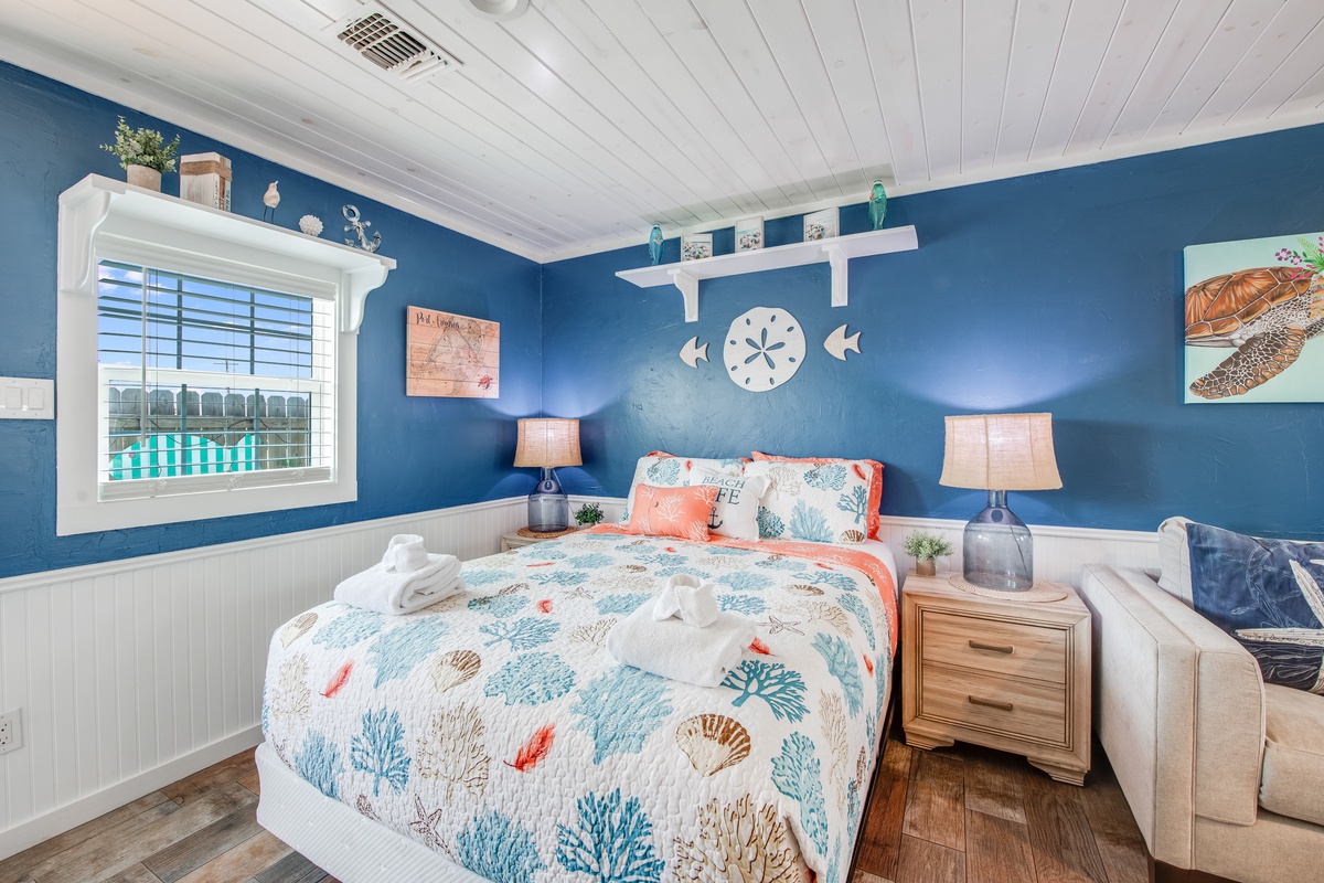 Drift off to sleep in your coastal bedroom, where ocean blues and sea-themed touches create a peaceful retreat with comfortable furnishings.