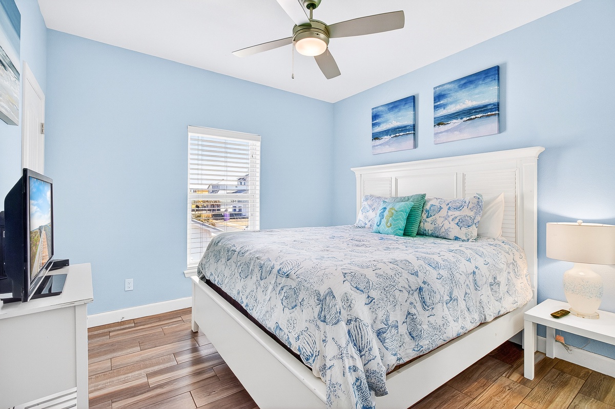 Drift off in this coastal bedroom where ocean blues meet crisp whites, creating your perfect seaside sanctuary with modern comfort.