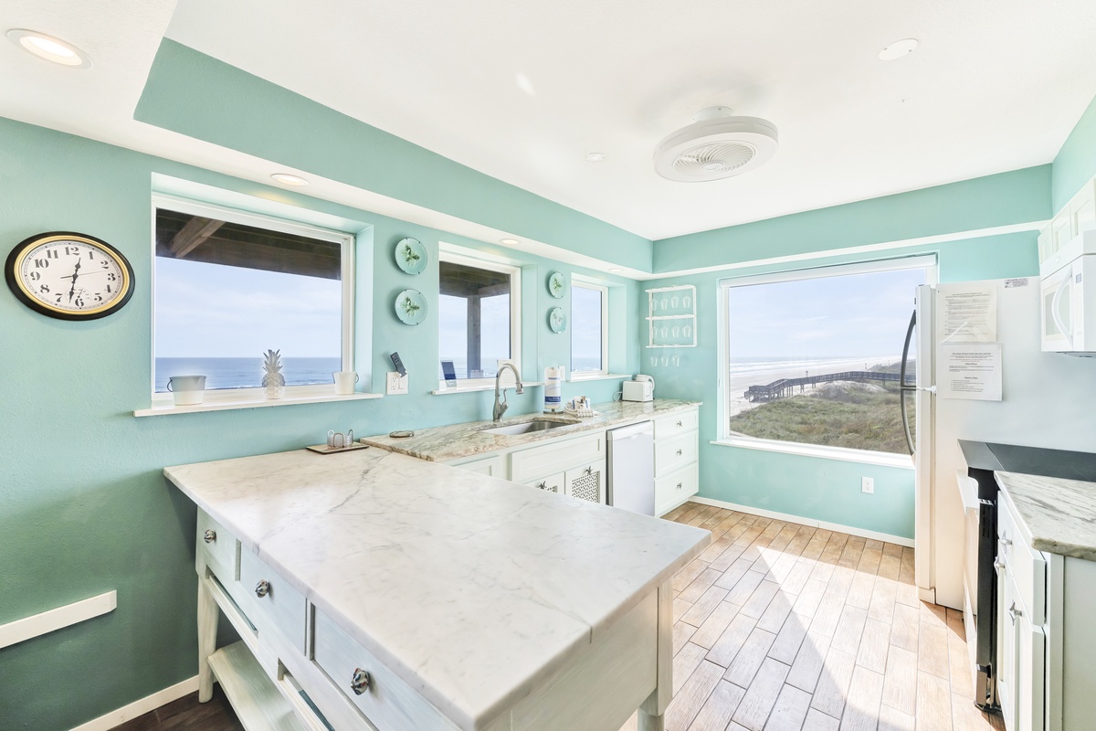 Your dream kitchen awaits with stunning ocean views and coastal charm. Cook with panoramic water vistas through every window.