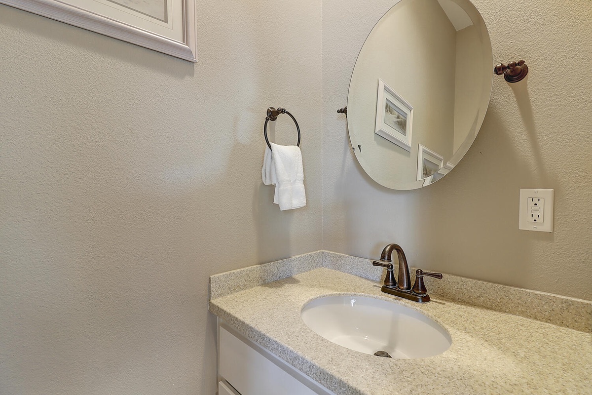 Freshen up at your private vanity with granite countertops, elegant bronze fixtures, and fluffy towels waiting for you.