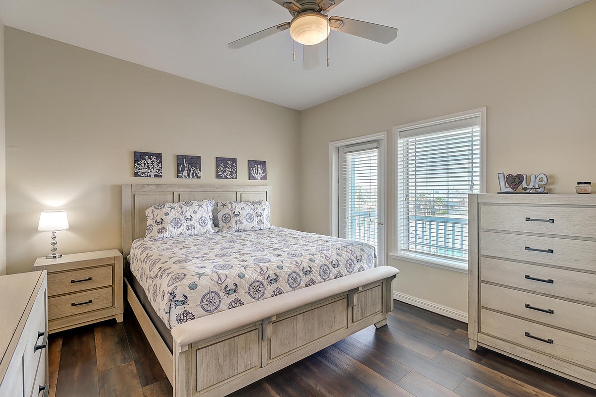 Drift off to sleep in your nautical-themed bedroom, where coastal patterns and warm wood tones create your perfect coastal retreat.