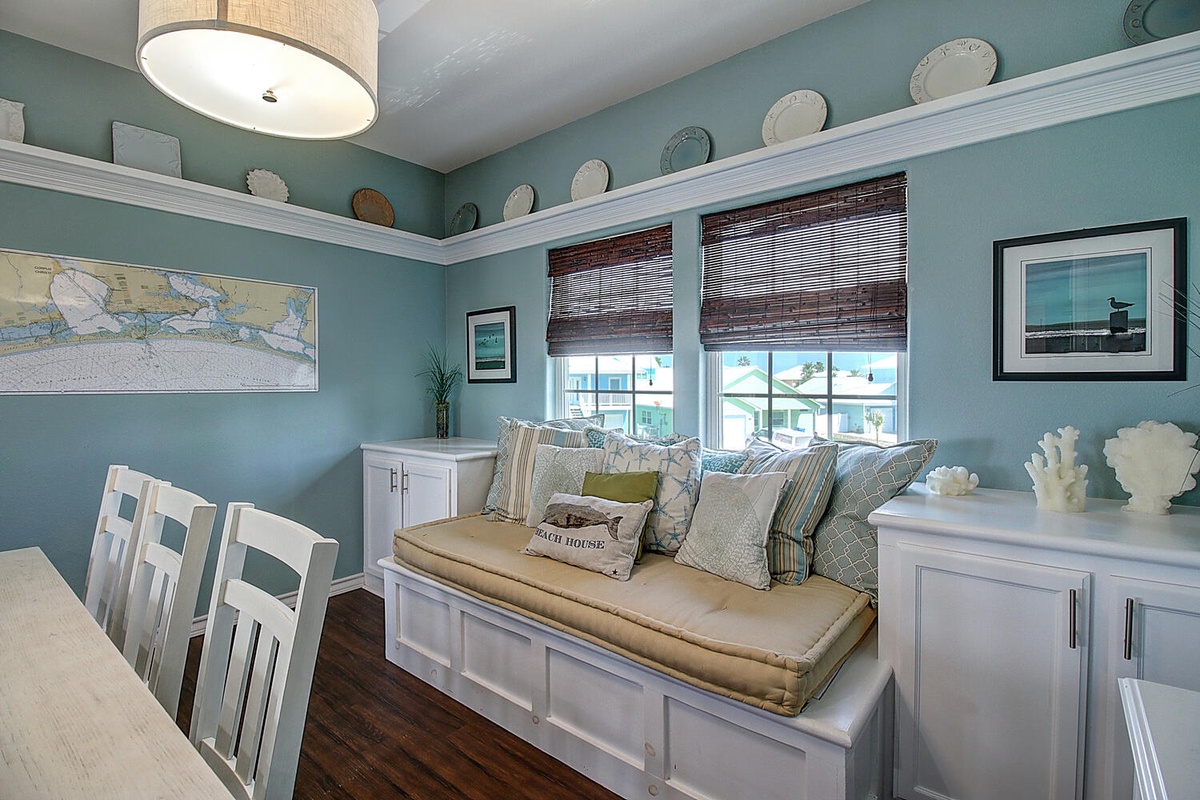 Unwind in your coastal dining nook with soft ocean hues and charming nautical touches creating the perfect seaside retreat.