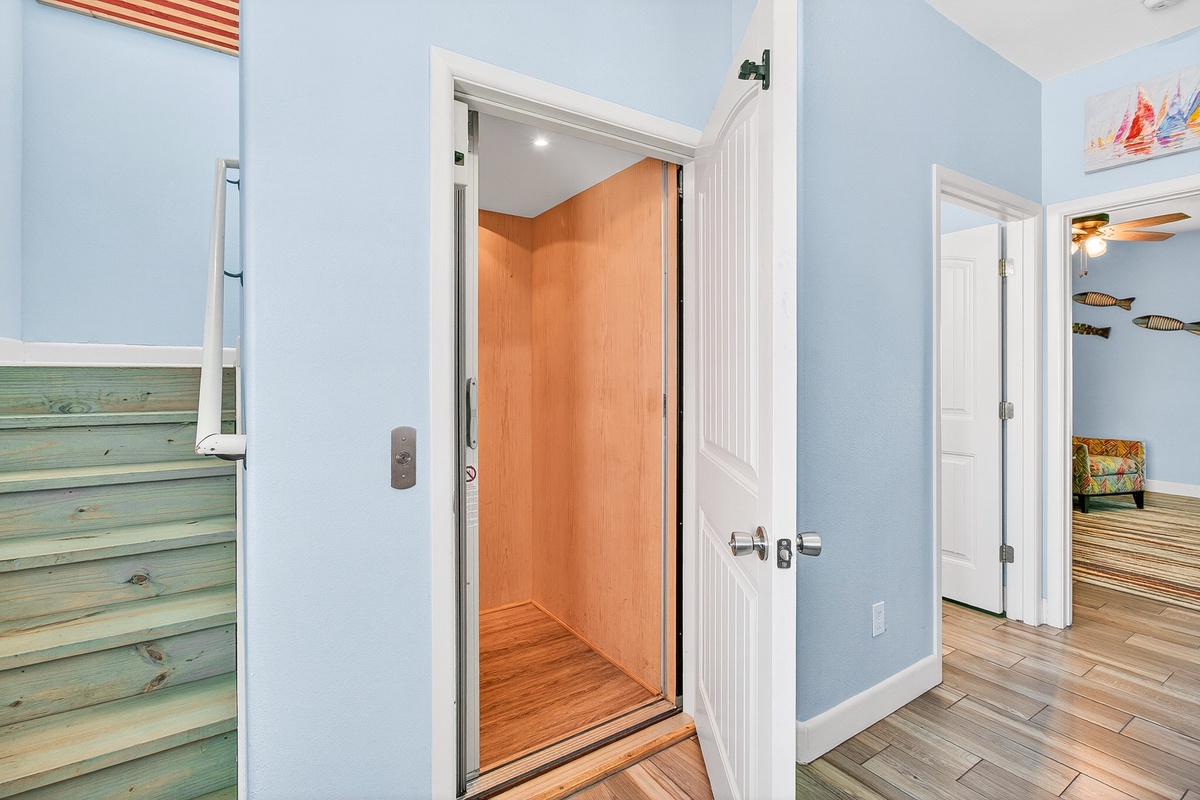 Step into your own private elevator, whisking you effortlessly between floors in this charming coastal retreat.