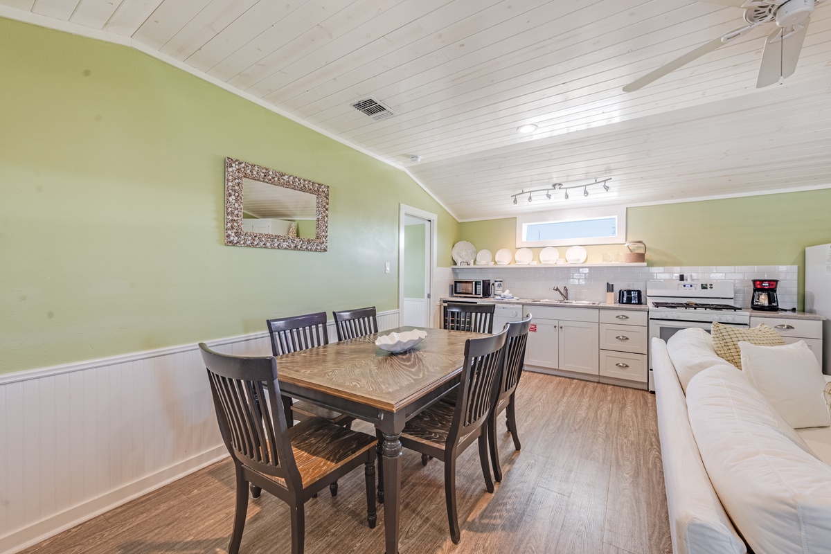 Your open-concept space combines a fully equipped kitchen with a cozy dining area, perfect for preparing and sharing meals together.