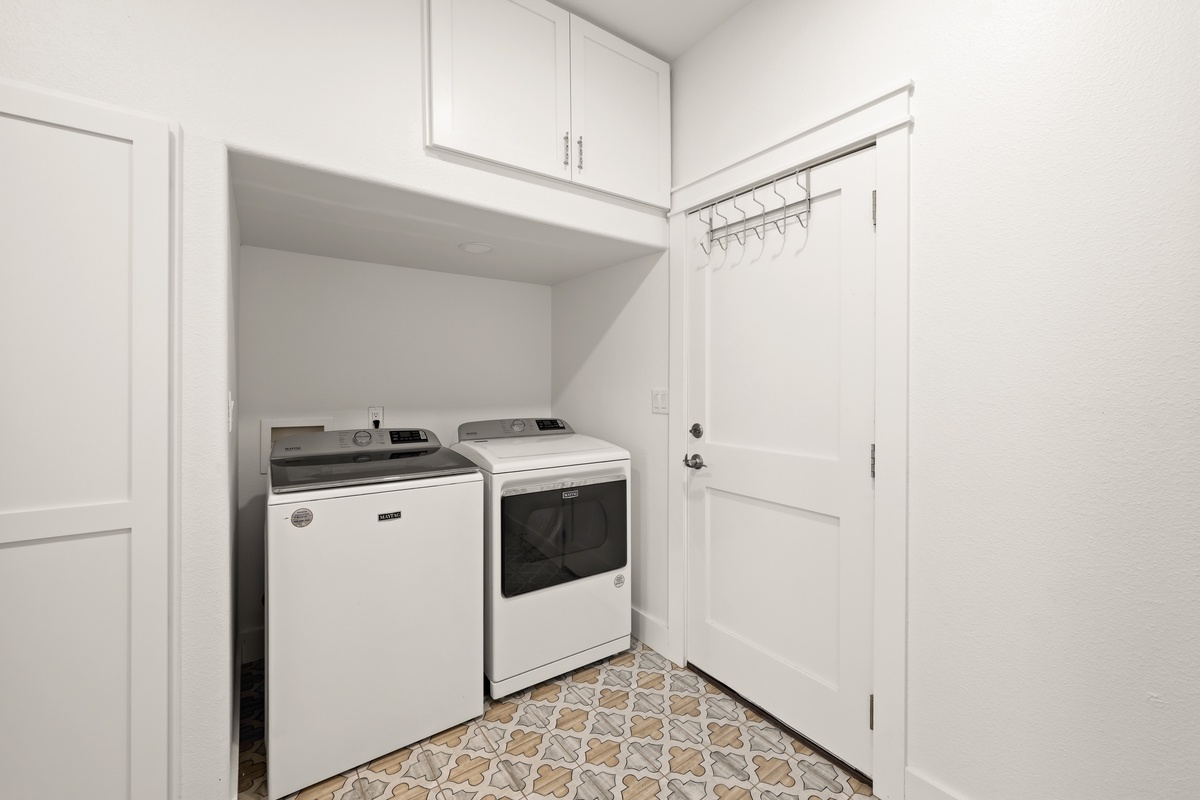 Your dedicated laundry space makes keeping up with vacation clothes a breeze—just toss in a load and relax while your essentials refresh.