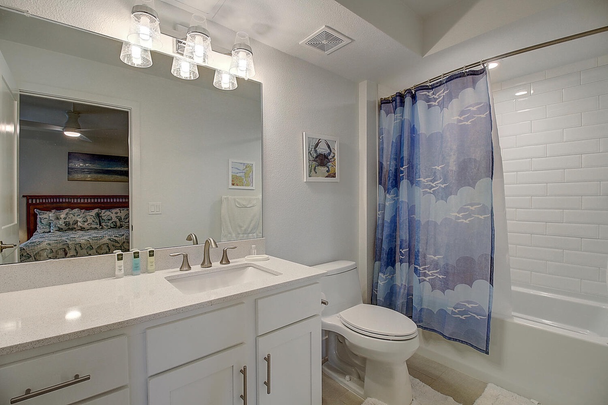 Step into your elegant bathroom featuring modern vanity, stylish lighting, and relaxing tub-shower combo for your perfect retreat.