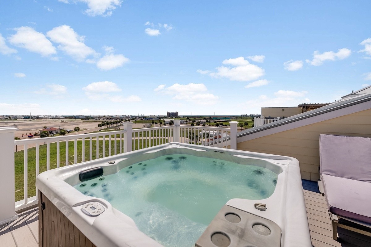 Soak in your private hot tub while taking in expansive views of the surrounding landscape on this elevated deck.