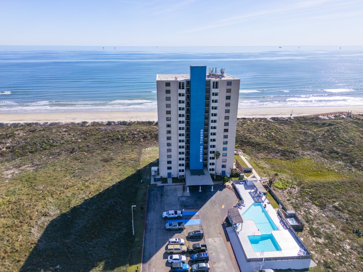 Modern beachfront tower offering stunning ocean views with direct beach access and outdoor pool facilities.