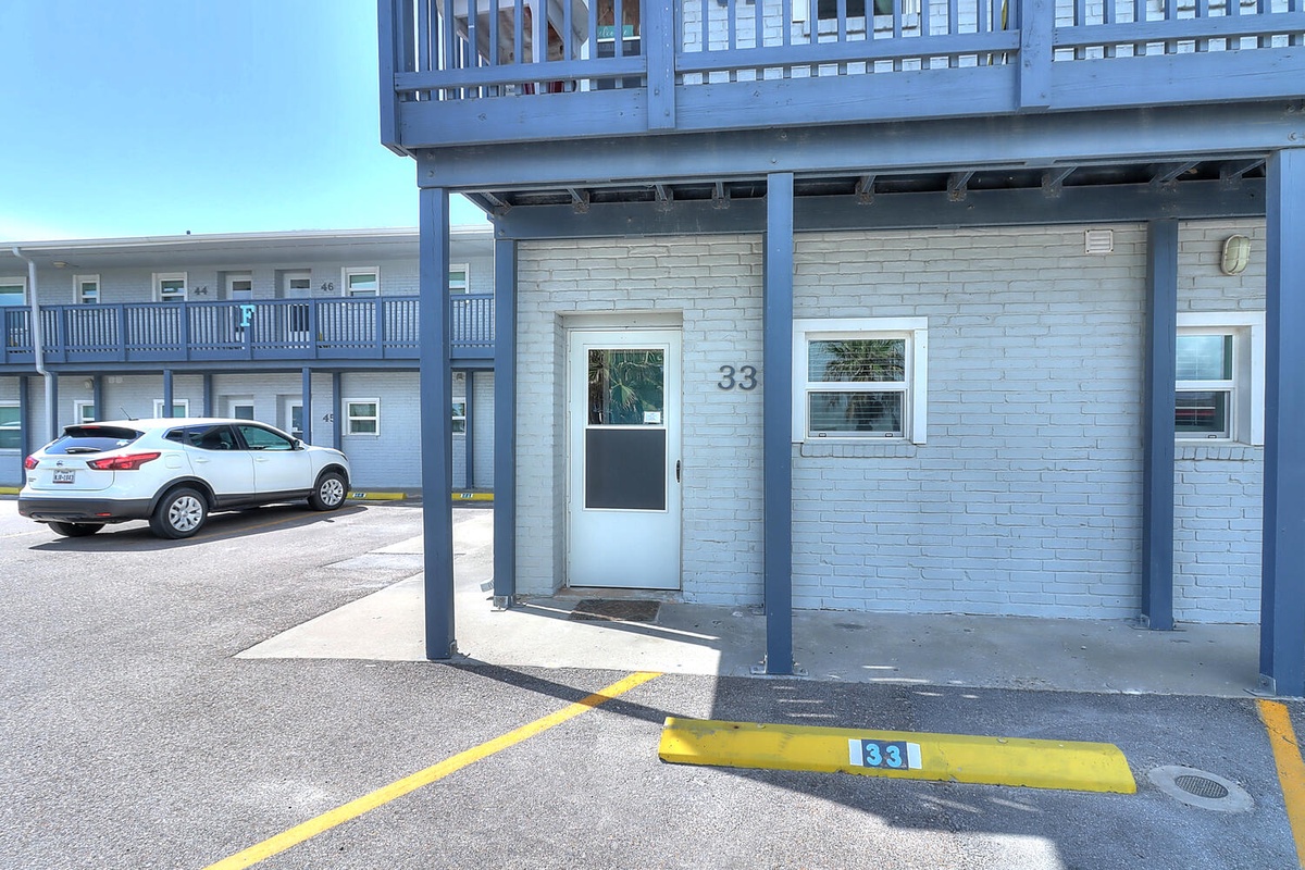 Your dedicated parking spot awaits right at your door, making arrival effortless at this charming beachside retreat.