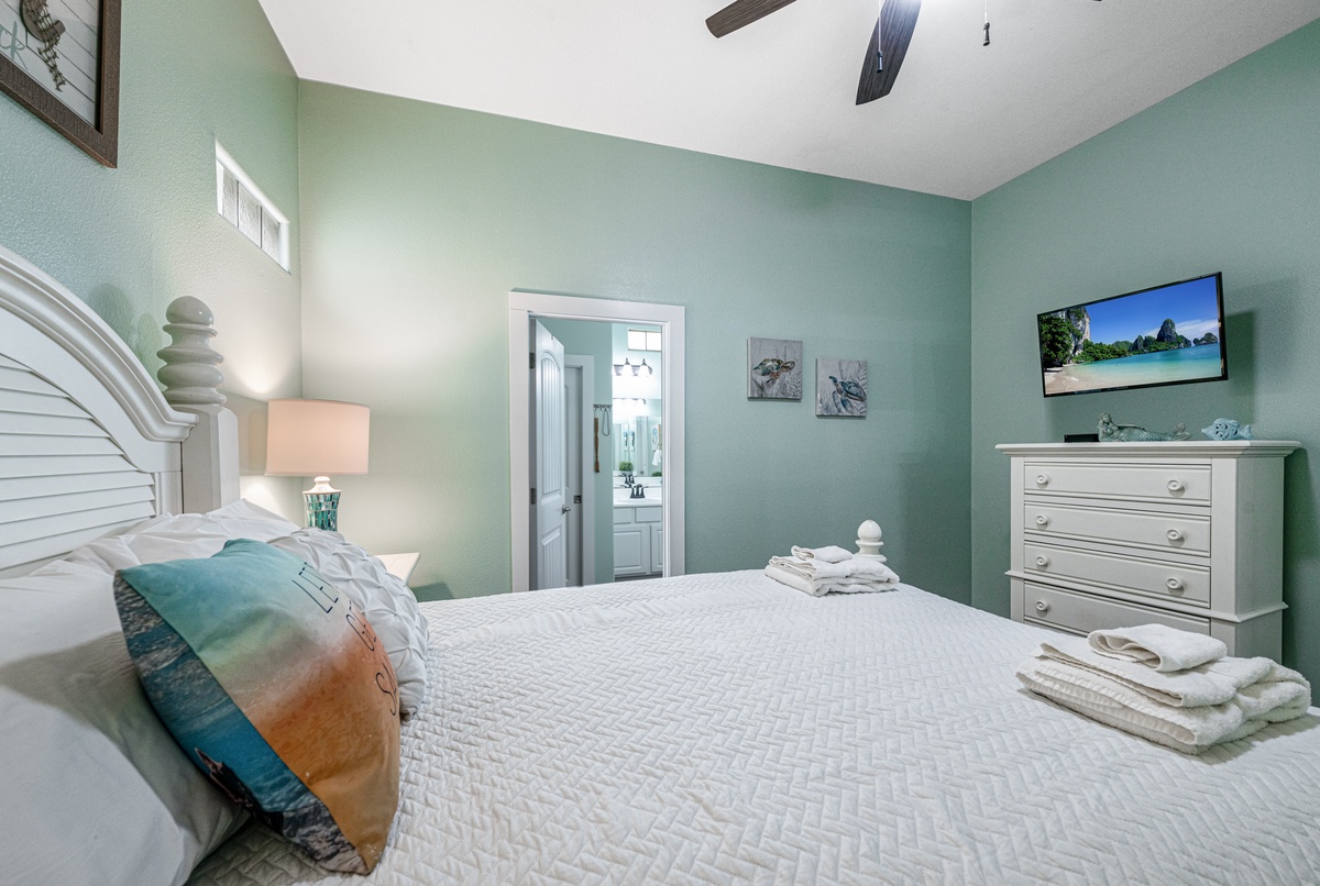 Drift off to peaceful sleep in your serene coastal bedroom, where soft mint walls and crisp linens create the perfect retreat after your adventures.