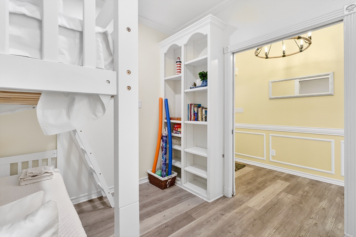 Your kids will love this charming bunk room with built-in storage for toys and books, plus a cozy reading nook.