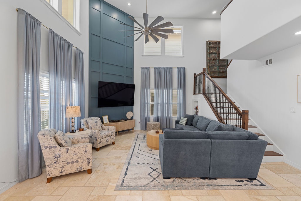 Relax in your spacious living room with soaring ceilings, cozy seating, and modern style—perfect for unwinding after exploring.