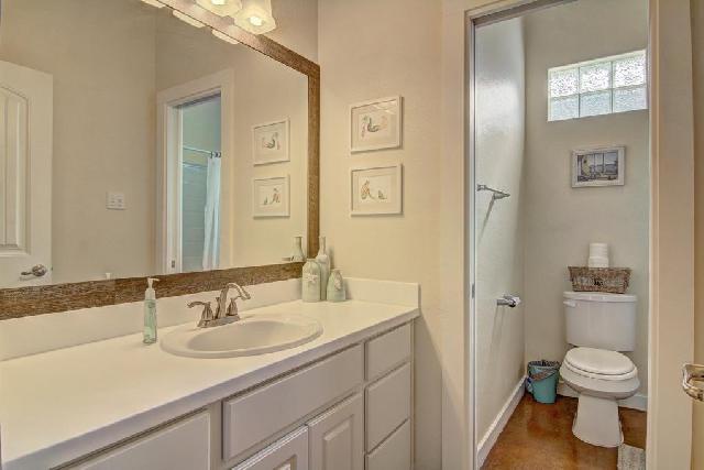 Your private bathroom features elegant marble countertops, stylish lighting, and a spacious shower for refreshing mornings.