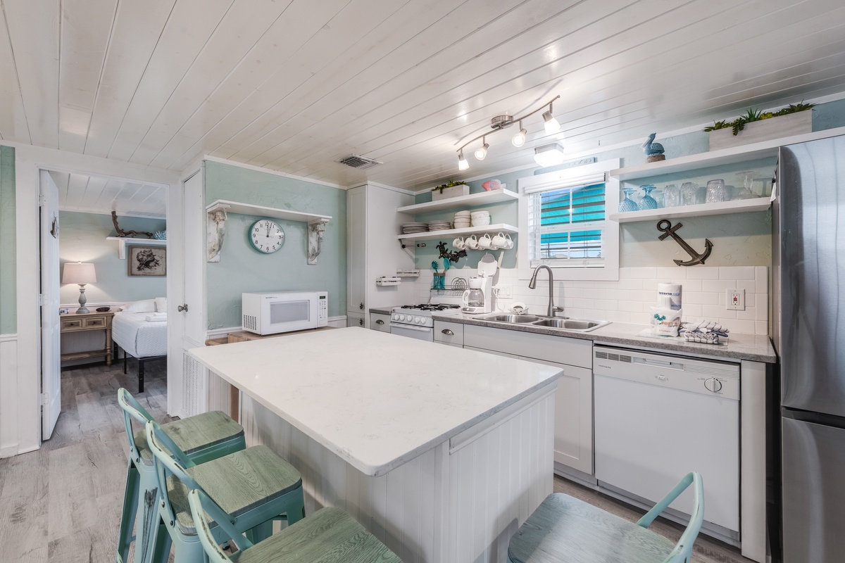 Your bright coastal kitchen features sea-glass touches and everything you need for memorable meals together.