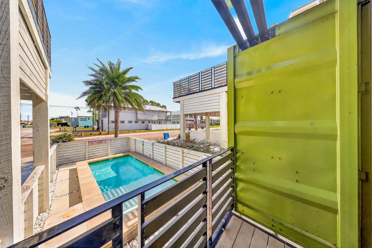 This balcony overlooks your private pool and the surrounding grounds. Relax in the sunshine, enjoy views of swaying palms, and take in the modern architecture that makes this property unique.