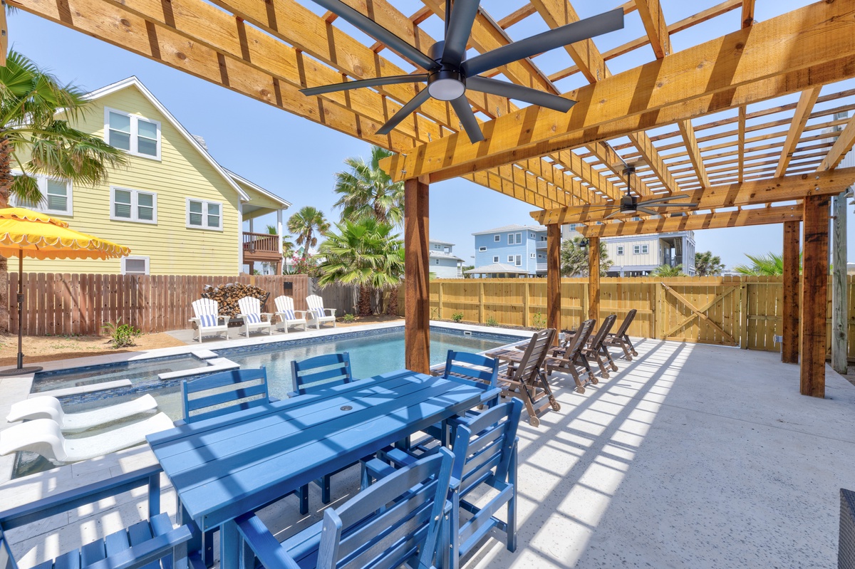 Gather with loved ones under your shaded pergola while enjoying pool views and tropical breezes in this perfect outdoor entertaining space.